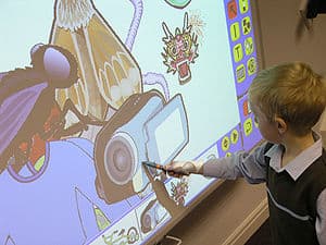 A student using an Interactive Whiteboard