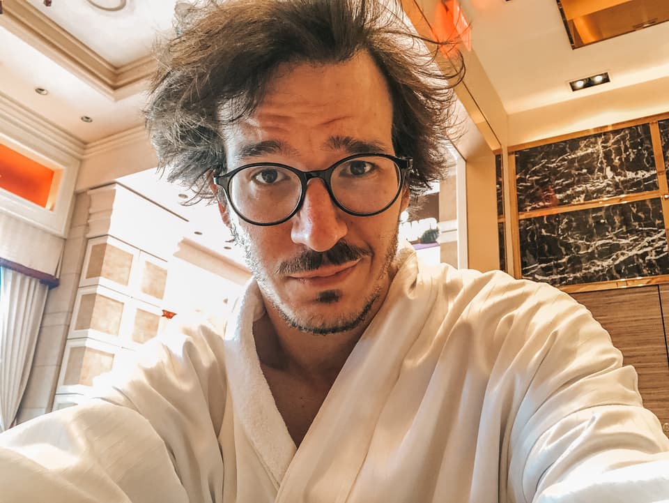 Swizec writing furiously in a Las Vegas cafe to hit a deadline